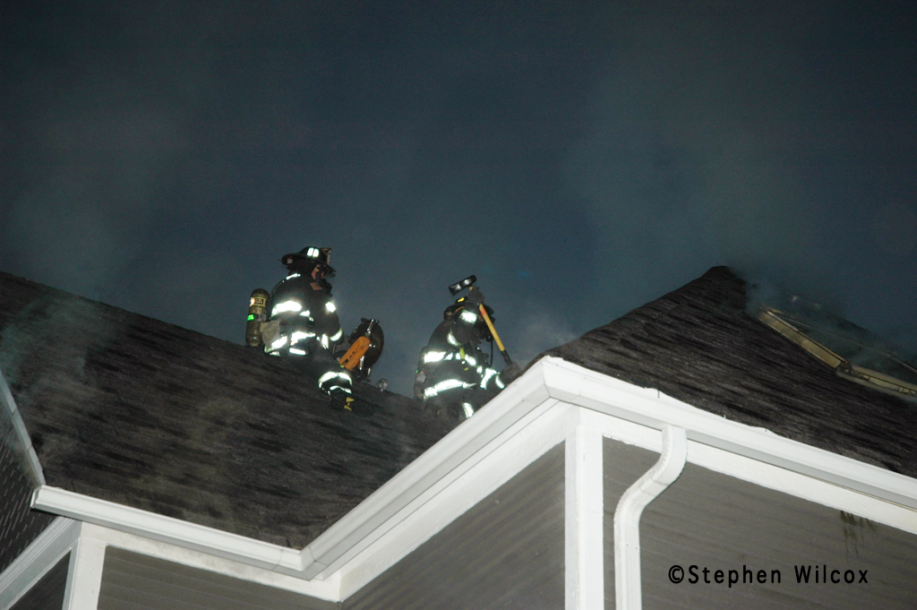 Wheaton house fire on Ellis 6/17/11 firefighters ventilate the roof