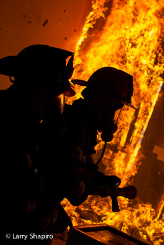 Woodstock Fire Rescue District training fire firefighters silhouette