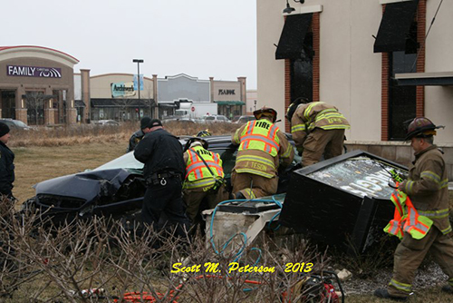 firefighters extricate drive from car
