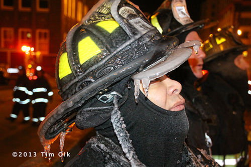 firefighter with ice covered helmet