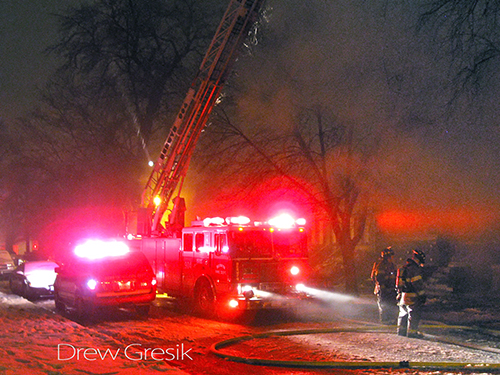 Seagrave ladder at a house fire in Berwyn