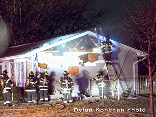 firefighters working at house fire