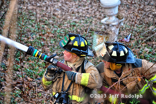 firefighters with hose 