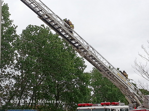 firemen climbing ladder