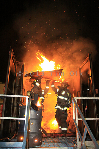 firemen training with live fire