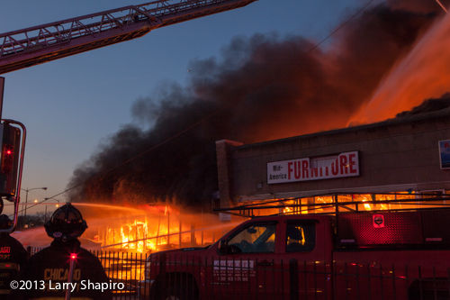 Massive 4-alarm fire on Chicago's north side destroys strip center and 5 stores.