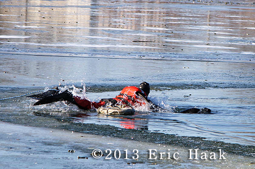 firemen rescue dog from frozen pond