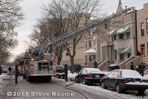Chicago firefighters at winter fire scene