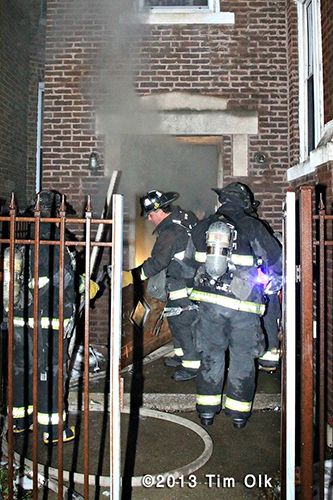 Chicago firefighters at night fire scene involving an apartment building