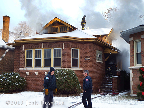 Chicago firemen battle winter fire in a Chicago bungalow