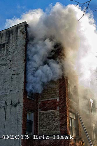 Chicago firemen battle an apartment is freezing temperatures.