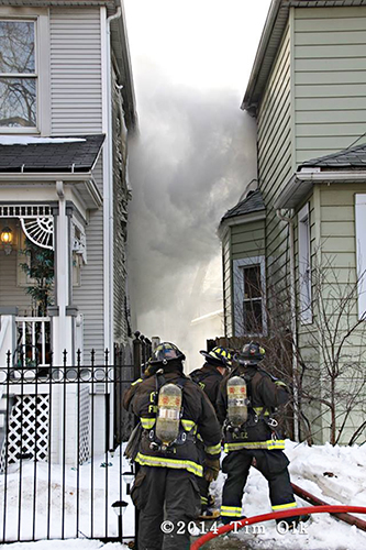 Chicago firemen fight winter house fire