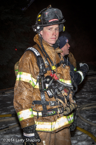 firefighter at night covered with ice