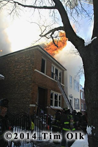 fire blows out the roof of Chicago two-flat