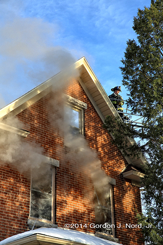 smoke from windows at house fire