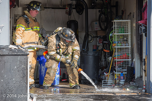firemen with hose line
