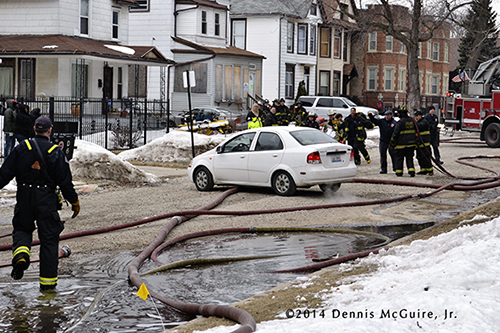 car on hose at fire scene