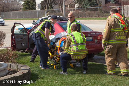 paramedics tend to a crash victim
