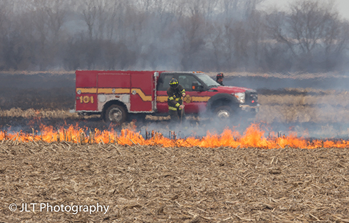 grass fire with brush truck