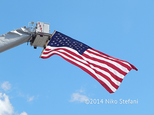 American flag suspended from fire truck
