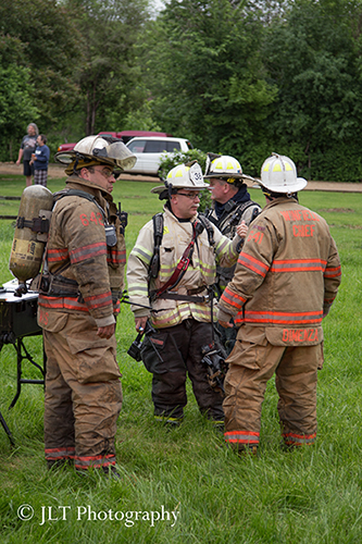 chief fire officers confer at fire scene