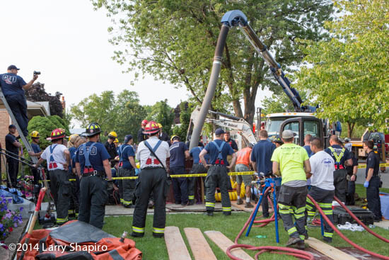 firemen rescue worker trapped in a trench