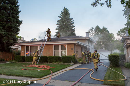 firemen fight house fire