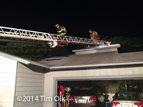 firemen on aerial ladder