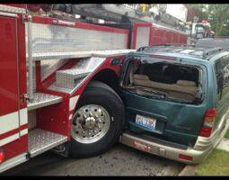 fire truck hits parked car