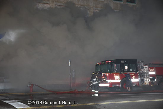 smokey Chicago fire scene with fire engine