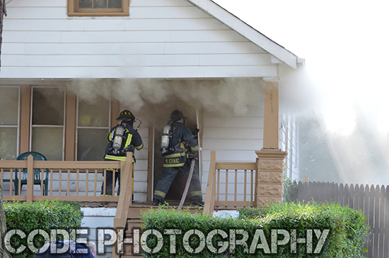 firemen enter house filled with smoke