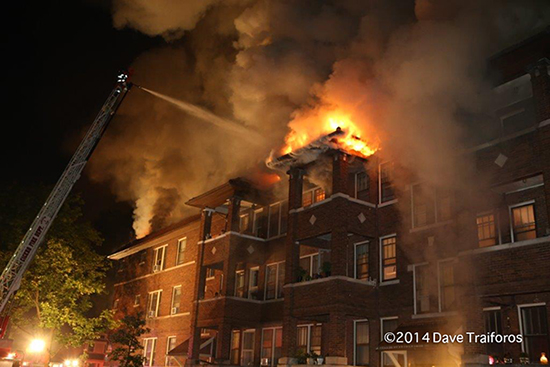 apartment building on fire at night