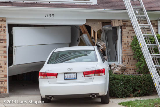 car drives into house and damages structure