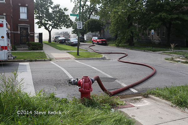 fire hydrant with hose attached