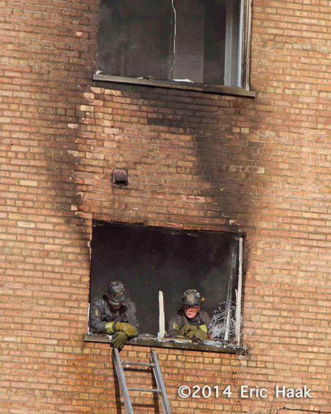 firemen rest after battling a fire