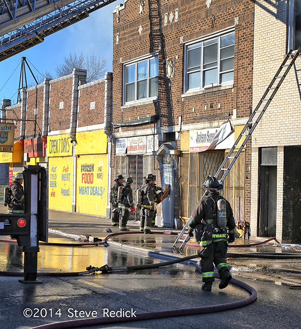 firemen force entry into storefront