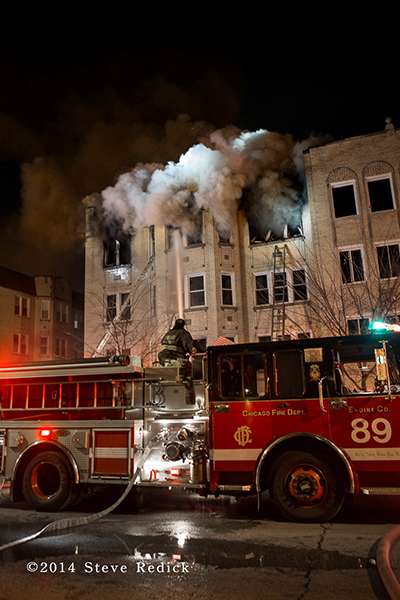 Chicago FD Engine 89 working at a night fire scene