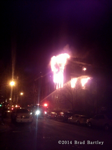 massive flames from building fire in Chicago at night