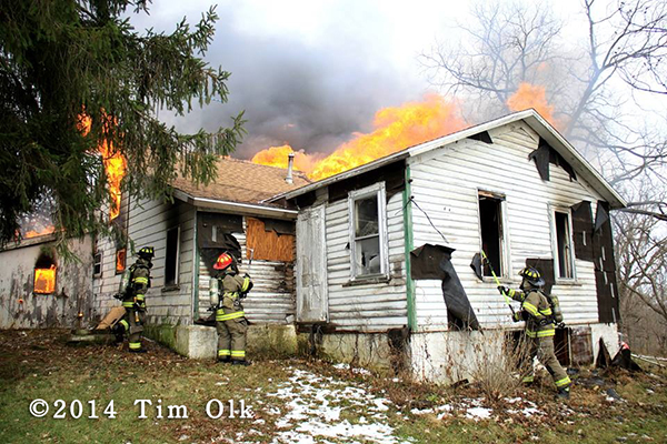 firemen burning a house