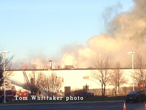 smoke from roof fire at commercial building