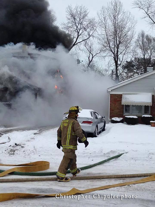 house on fire with lots of smoke