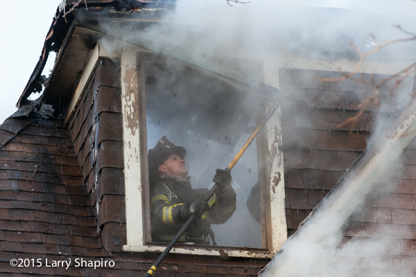 fireman overhauls house after fire