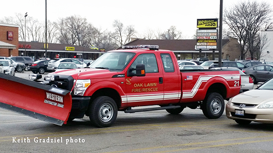 fire department pickup truck with snow plow