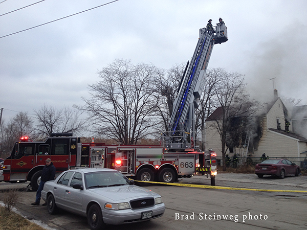 fire scene with tower ladder