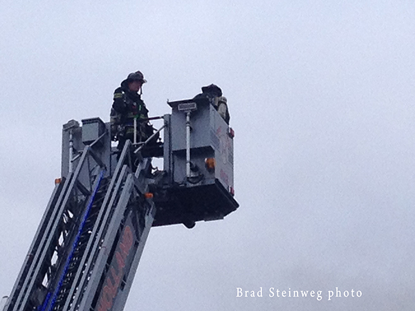fire scene with tower ladder
