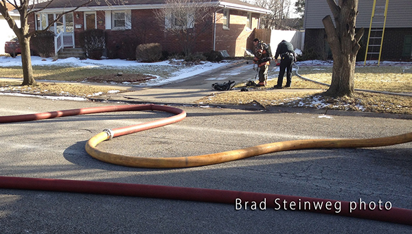 large diameter fire hose at fire scene