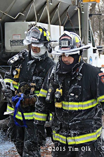 firemen covered with ice