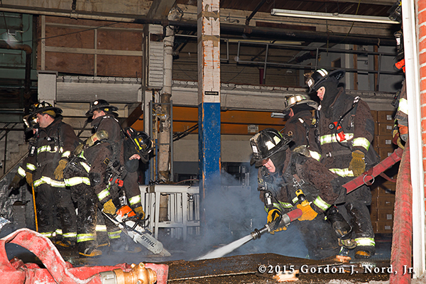 firemen battle commercial basement fire