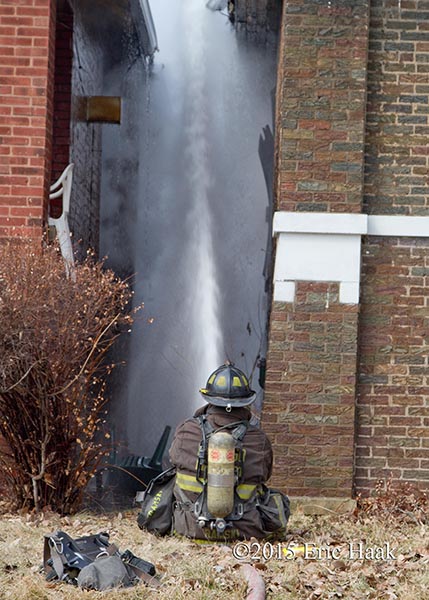 fireman with hose line at fire