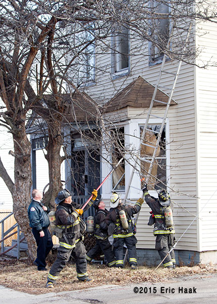 firemen working at a house fire